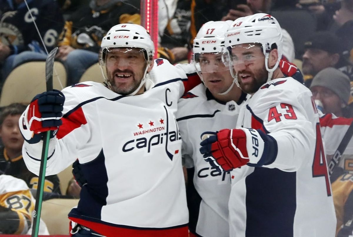 Mar 7, 2024; Pittsburgh, Pennsylvania, USA; Washington Capitals left wing Alex Ovechkin (left) celebrates his power play goal with right wing Tom Wilson (43) and center Dylan Strome (17) against the Pittsburgh Penguins during the second period at PPG Paints Arena.