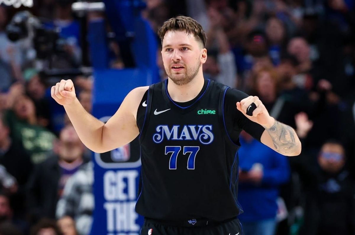 Jan 24, 2024; Dallas, Texas, USA;  Dallas Mavericks guard Luka Doncic (77) reacts during the first half against the Phoenix Suns at American Airlines Center.