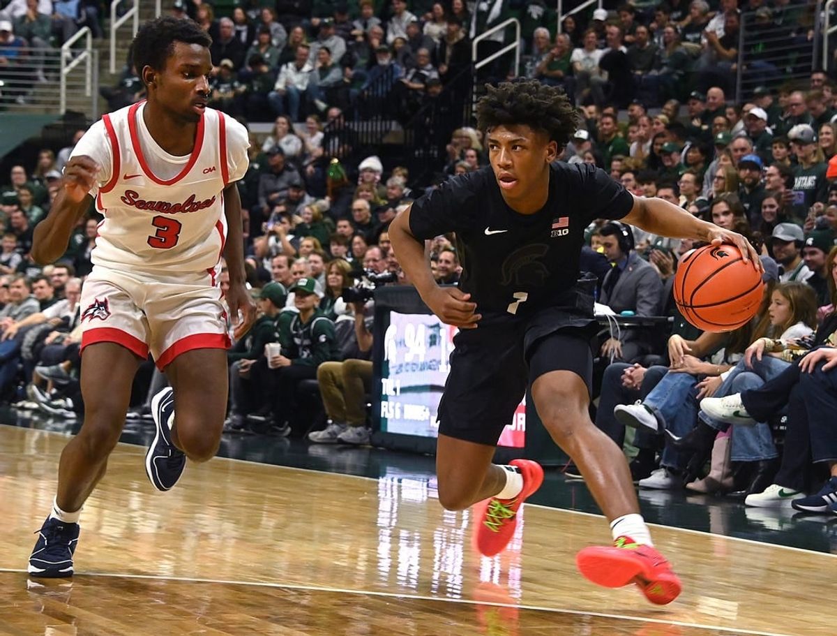 Dec 21, 2023; East Lansing, Michigan, USA; Michigan State Spartans guard Jeremy Fears Jr. (1) drives past Stony Brook Seawolves guard Toby Onyekonwu (3) during the second half at Jack Breslin Student Events Center.