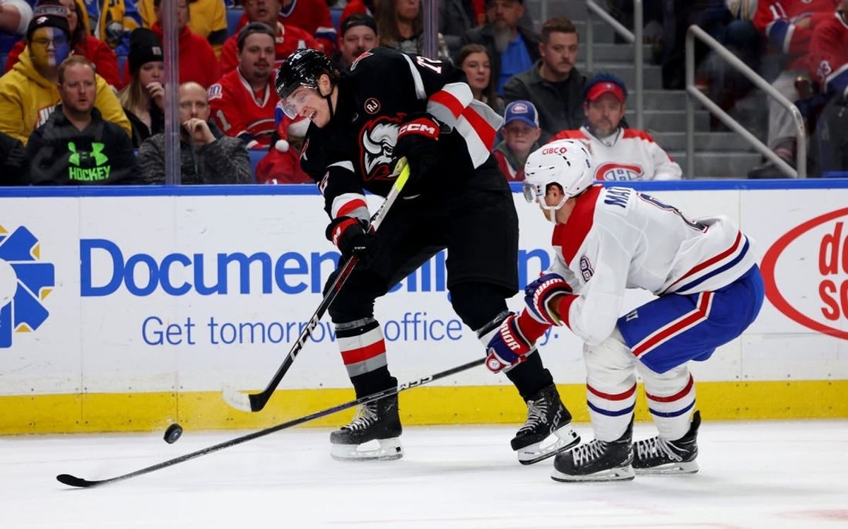 Dec 9, 2023; Buffalo, New York, USA;  Montreal Canadiens defenseman Mike Matheson (8) tries to block a shot by Buffalo Sabres right wing Tage Thompson (72) during the second period at KeyBank Center.