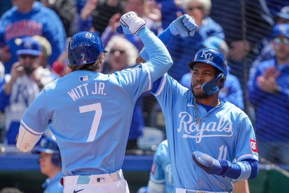 Apr 11, 2024; Kansas City, Missouri, USA; Kansas City Royals shortstop Bobby Witt Jr. (7) celebrates with third baseman Maikel Garcia (11) after hitting a two run home run against the Houston Astros in the first inning at Kauffman Stadium.