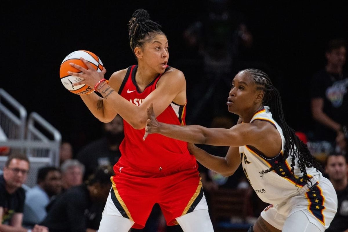 Jun 4, 2023; Indianapolis, Indiana, USA; Las Vegas Aces forward Candace Parker (3) looks to pass the ball while Indiana Fever center Queen Egbo (4) defends in the first half at Gainbridge Fieldhouse.