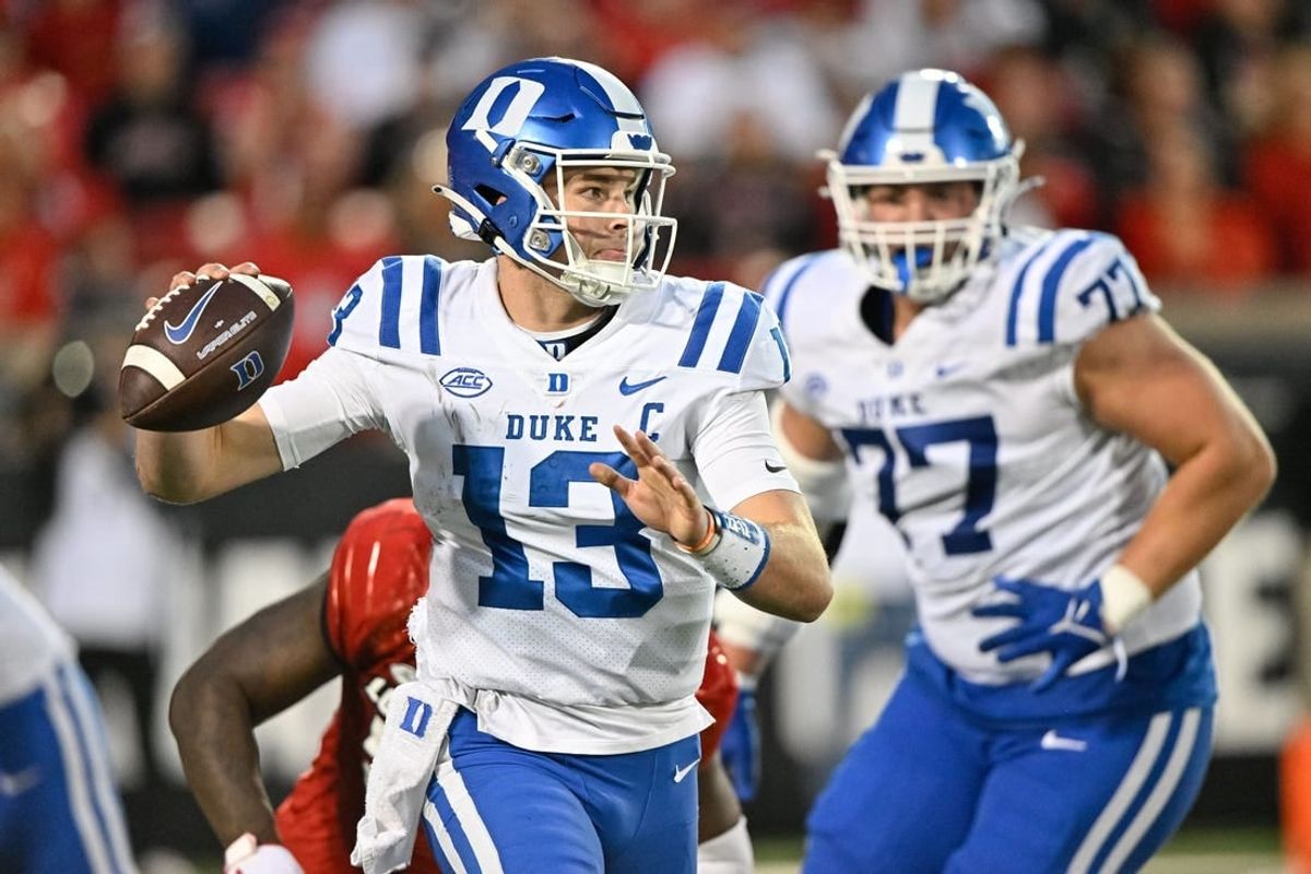 Oct 28, 2023; Louisville, Kentucky, USA;  Duke Blue Devils quarterback Riley Leonard (13) looks to pass the ball against the Louisville Cardinals during the second half at L&N Federal Credit Union Stadium.
