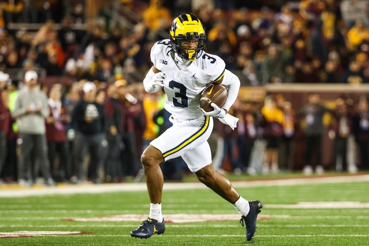 Oct 7, 2023; Minneapolis, Minnesota, USA; Michigan Wolverines defensive back Keon Sabb (3) returns an interception for a touchdown against the Minnesota Golden Gophers during the third quarter at Huntington Bank Stadium.
