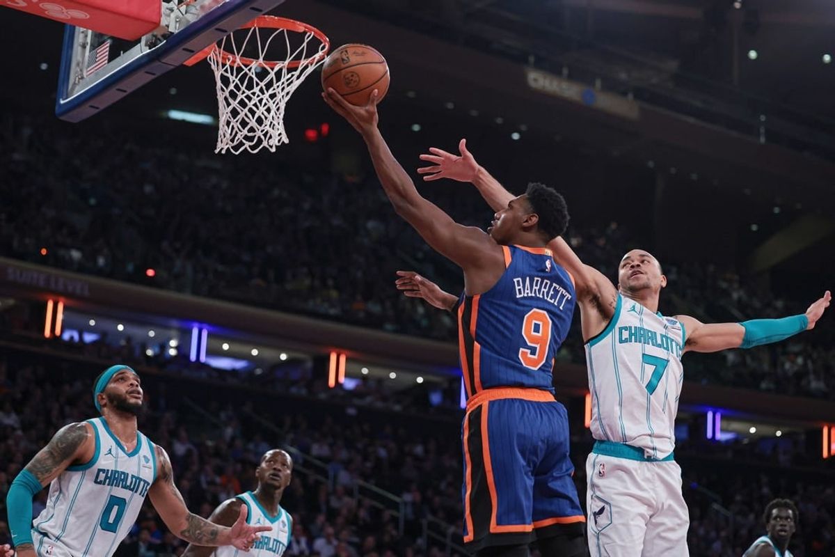 Nov 28, 2023; New York, New York, USA; New York Knicks guard RJ Barrett (9) drives to the basket as Charlotte Hornets guard Bryce McGowens (7) and forward Miles Bridges (0) defend during the first half at Madison Square Garden.