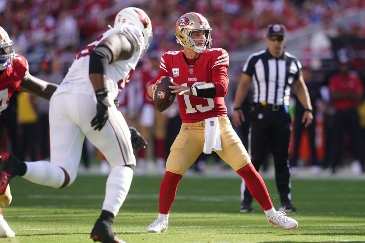 Oct 1, 2023; Santa Clara, California, USA; San Francisco 49ers quarterback Brock Purdy (13) looks to throw a pass against the Arizona Cardinals in the fourth quarter at Levi's Stadium.