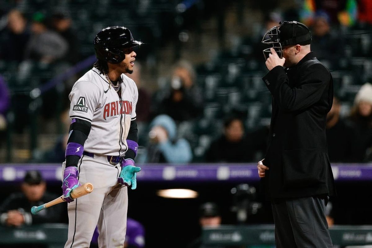 Apr 8, 2024; Denver, Colorado, USA; Arizona Diamondbacks second baseman Ketel Marte (4) argues a call with home plate umpire Nic Lentz (59) in the ninth inning against the Colorado Rockies at Coors Field.