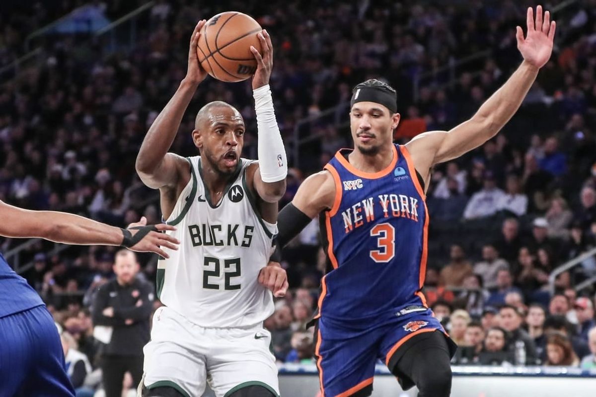 Dec 23, 2023; New York, New York, USA;  Milwaukee Bucks forward Khris Middleton (22) looks to drive past New York Knicks guard Josh Hart (3) in the fourth quarter at Madison Square Garden.