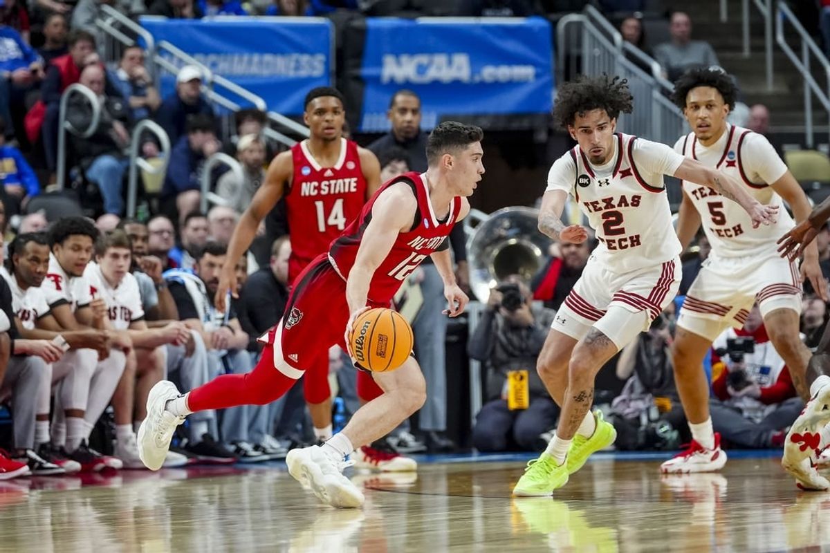 Mar 21, 2024; Pittsburgh, PA, USA; North Carolina State Wolfpack guard Michael O'Connell handles the ball during the first half in the first round of the 2024 NCAA Tournament at PPG Paints Arena.