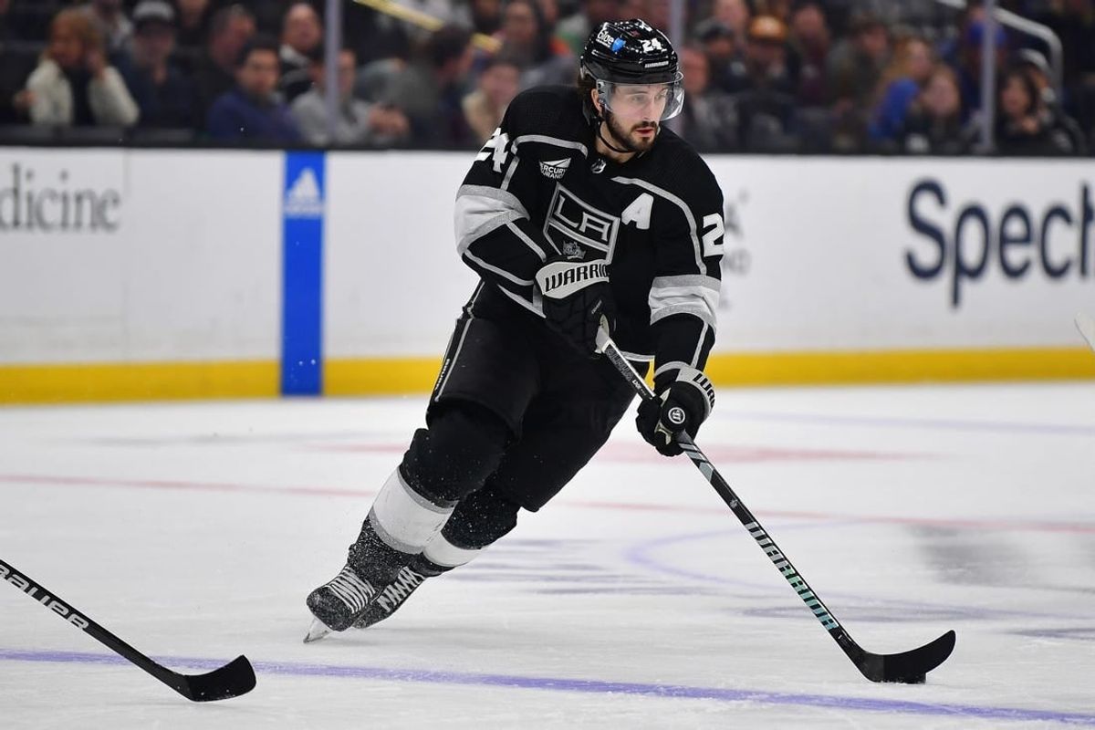 Dec 30, 2023; Los Angeles, California, USA; Los Angeles Kings center Phillip Danault (24) moces the puck against the Edmonton Oilers during the second period at Crypto.com Arena.
