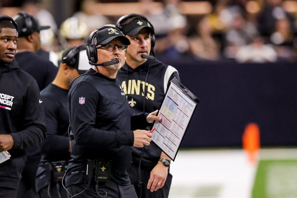 Oct 16, 2022; New Orleans, Louisiana, USA; New Orleans Saints offensive coordinator Pete Carmichael looks at the video boards against the Cincinnati Bengals during the first half at Caesars Superdome.