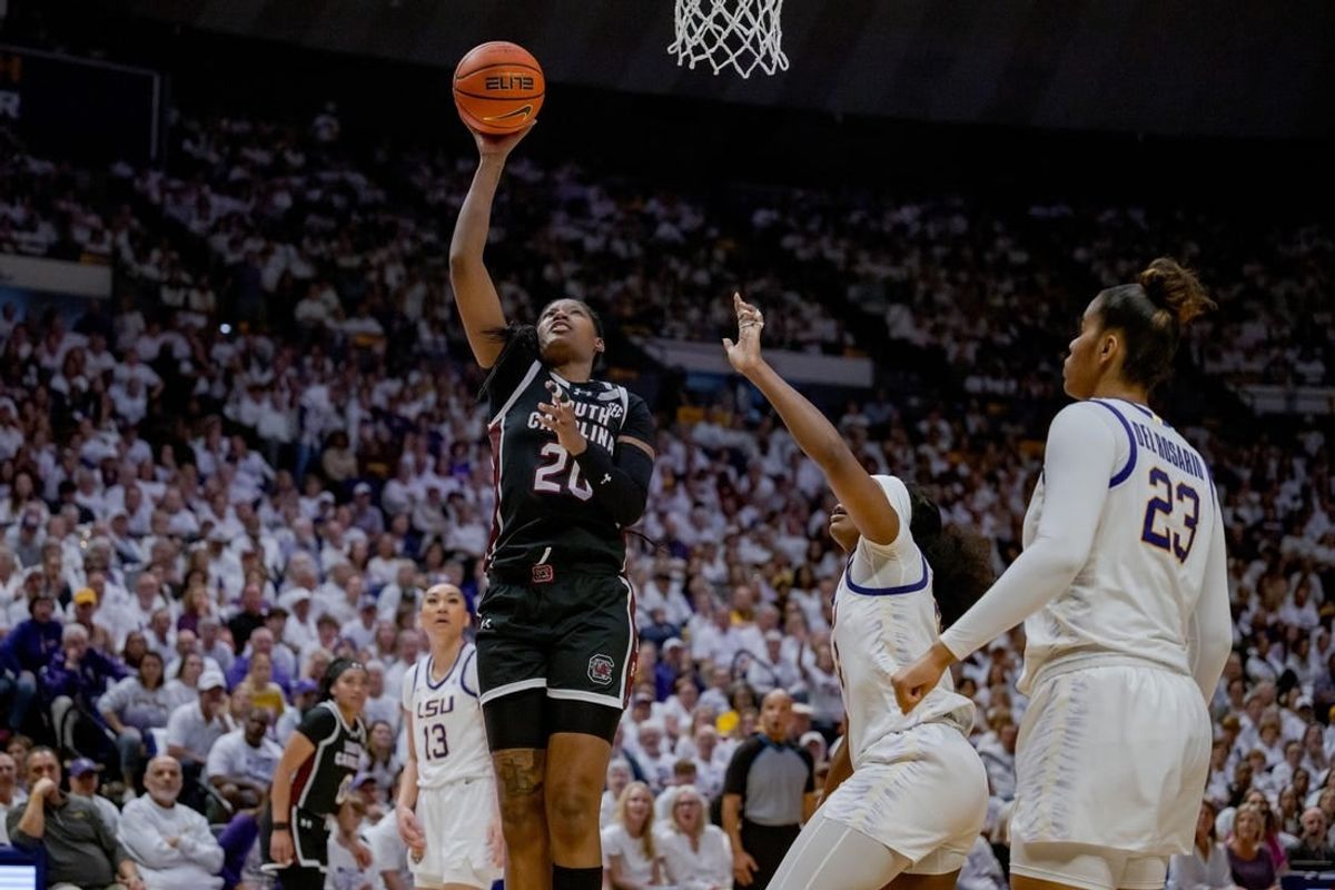 Jan 25, 2024; Baton Rouge, Louisiana, USA; South Carolina Gamecocks forward Sania Feagin (20) shoots against LSU Lady Tigers guard Aneesah Morrow during the second half at Pete Maravich Assembly Center.