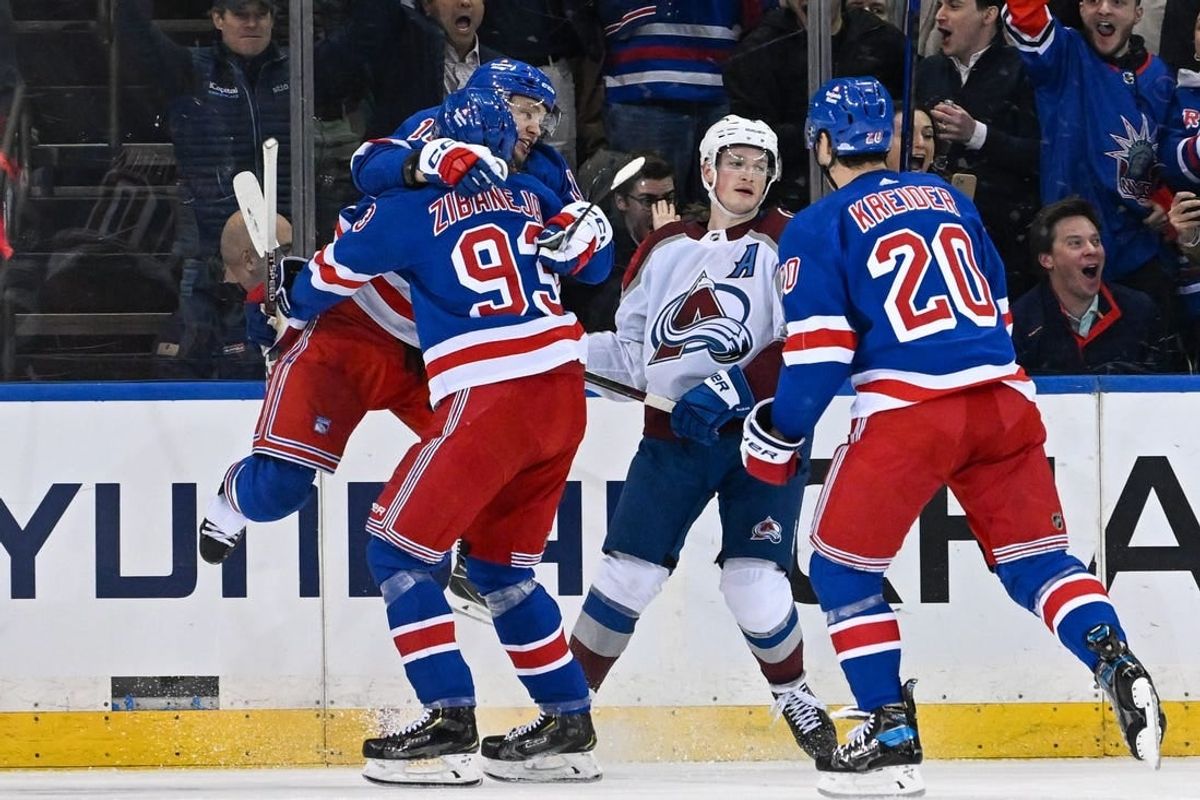 Feb 5, 2024; New York, New York, USA;  New York Rangers left wing Artemi Panarin (10) celebrates his game tying goal with New York Rangers center Mika Zibanejad (93) against the Colorado Avalanche during the third period at Madison Square Garden.