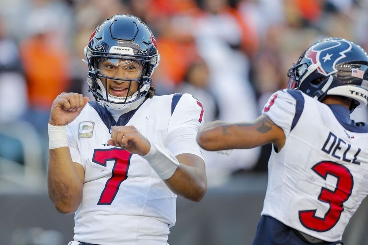 Nov 12, 2023; Cincinnati, Ohio, USA; Houston Texans quarterback C.J. Stroud (7) reacts after scoring a touchdown with wide receiver Tank Dell (3) in the second half against the Cincinnati Bengals at Paycor Stadium.
