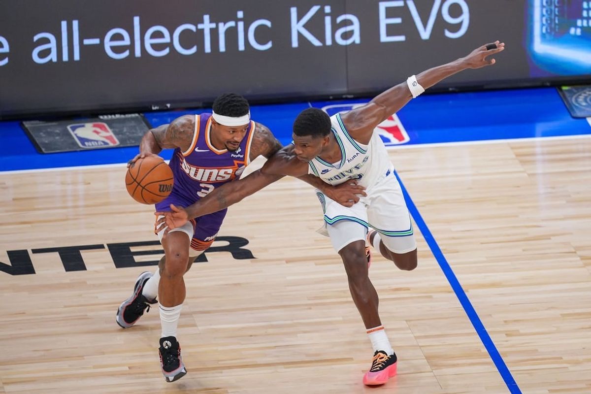 Apr 23, 2024; Minneapolis, Minnesota, USA; Minnesota Timberwolves guard Anthony Edwards (5) defends against Phoenix Suns guard Bradley Beal (3) in the third quarter during game two of the first round for the 2024 NBA playoffs at Target Center.