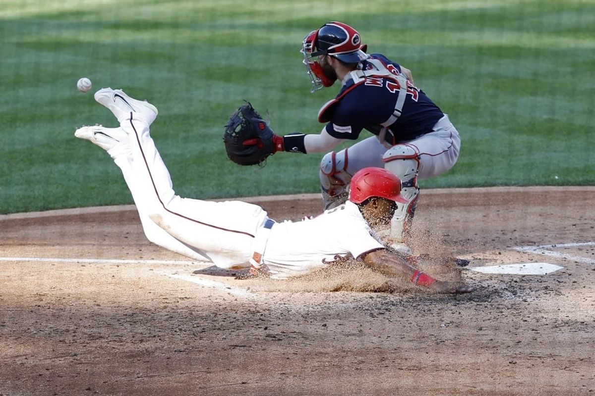 Aug 17, 2023; Washington, District of Columbia, USA; Washington Nationals second baseman Jeter Downs (3) scores a run ahead of a tag by Boston Red Sox catcher Connor Wong (12) on a two run double by Nationals designated hitter Joey Meneses (not pictured) during the fifth inning at Nationals Park.