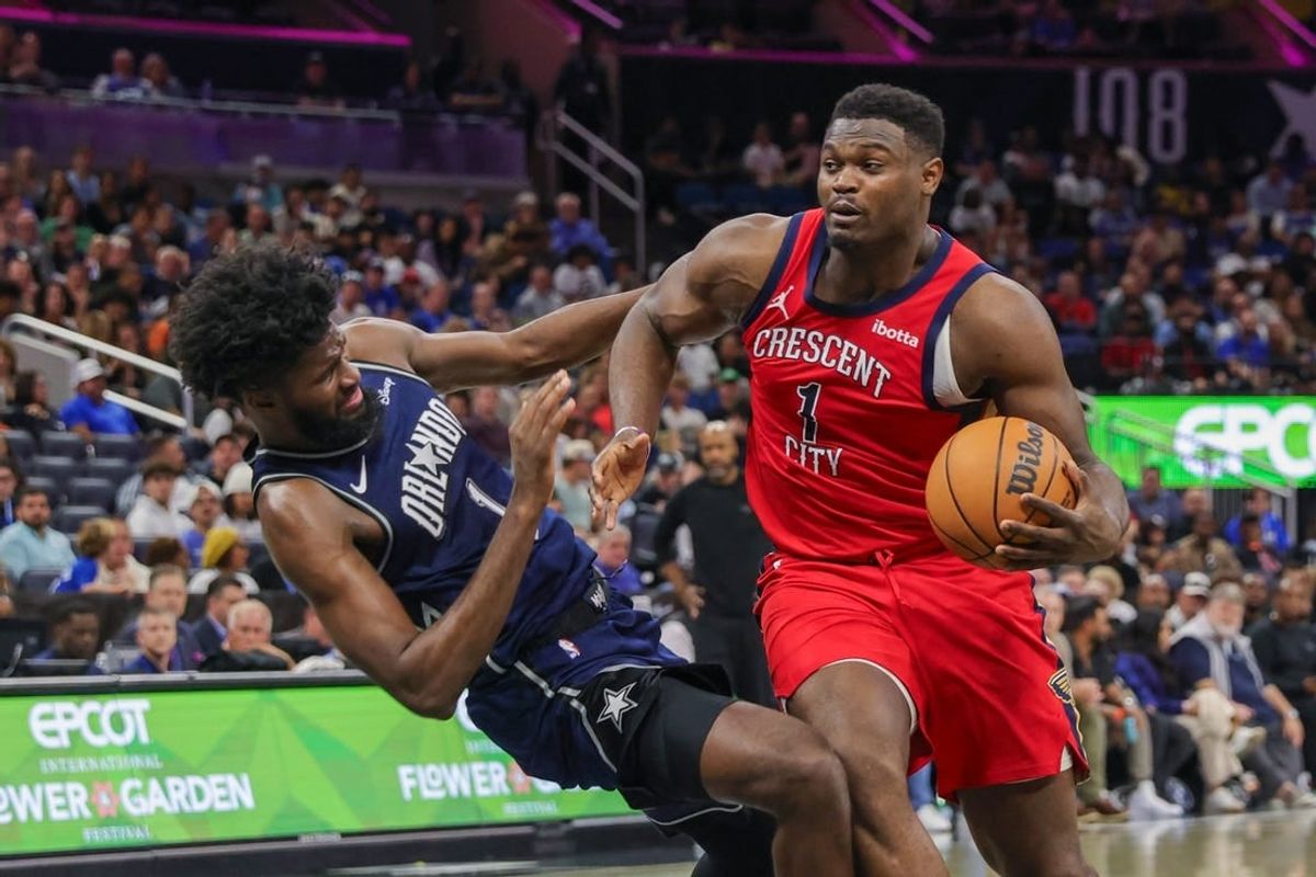 Mar 21, 2024; Orlando, Florida, USA; New Orleans Pelicans forward Zion Williamson (1) is fouled by Orlando Magic forward Jonathan Isaac (1) during the second half at KIA Center.