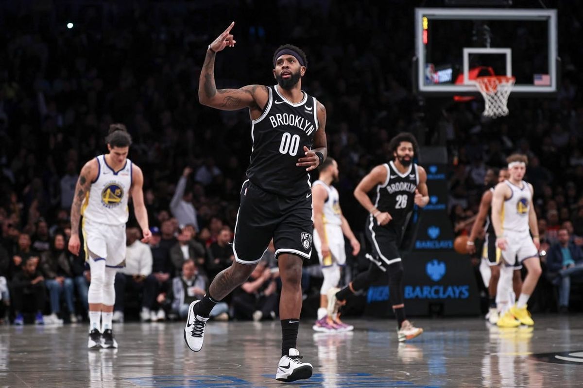 Feb 5, 2024; Brooklyn, New York, USA; Brooklyn Nets forward Royce O'Neale (00) reacts after making a three point basket during the second half against the Golden State Warriors at Barclays Center.