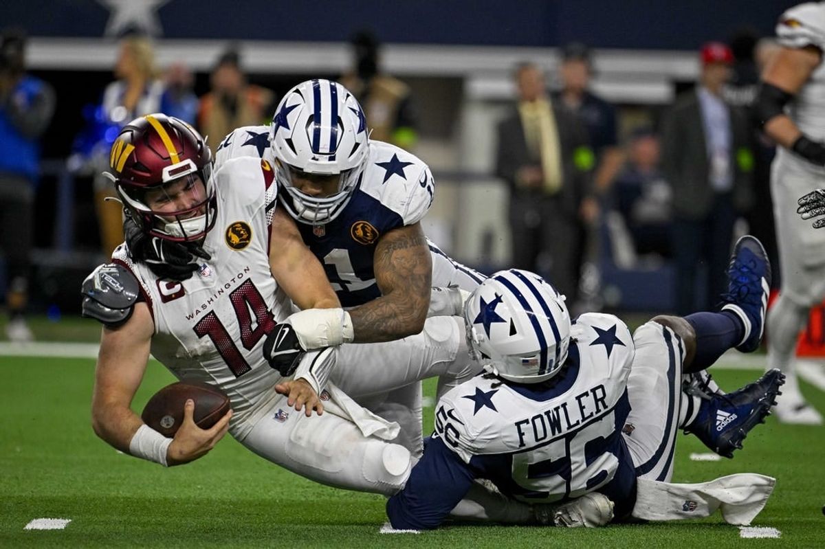 Nov 23, 2023; Arlington, Texas, USA; Dallas Cowboys linebacker Micah Parsons (11) and defensive end Dante Fowler Jr. (56) and Washington Commanders quarterback Sam Howell (14) in action during the game between the Dallas Cowboys and the Washington Commanders at AT&T Stadium.