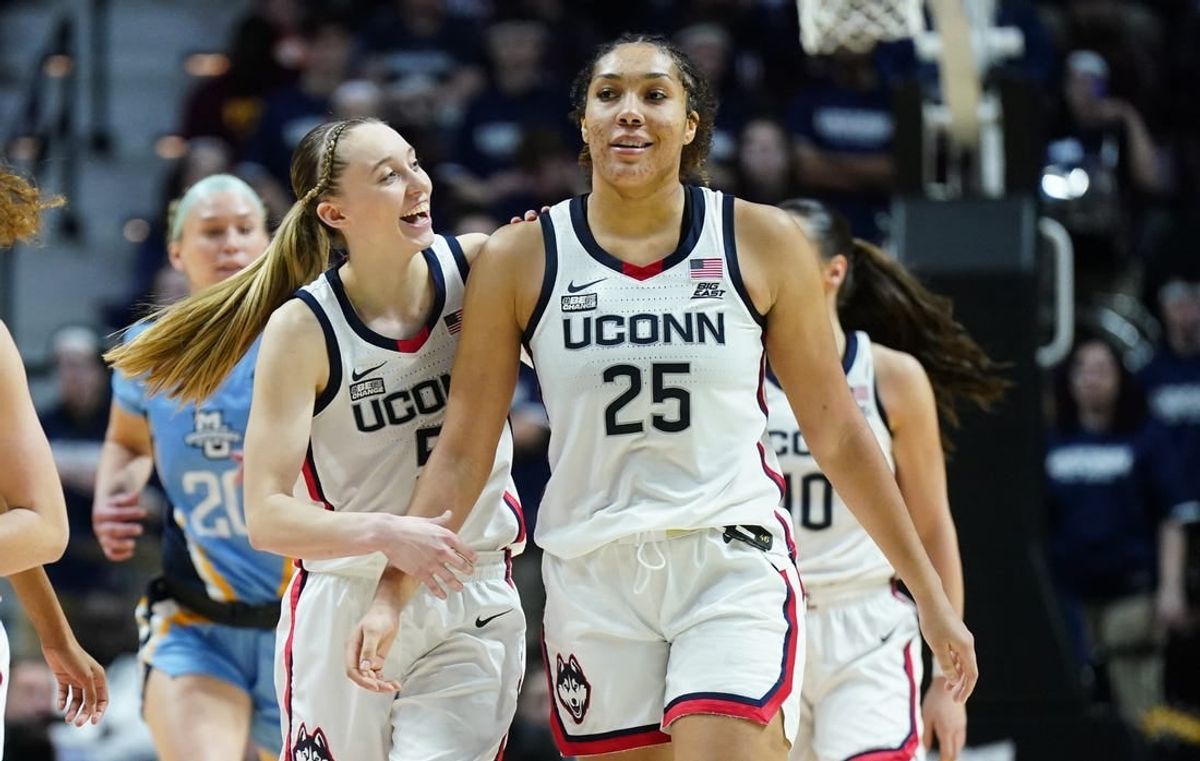 Mar 10, 2024; Uncasville, CT, USA; UConn Huskies guard Paige Bueckers (5) reacts with forward Ice Brady (25) after a play against the Marquette Golden Eagles in the second half at Mohegan Sun Arena.