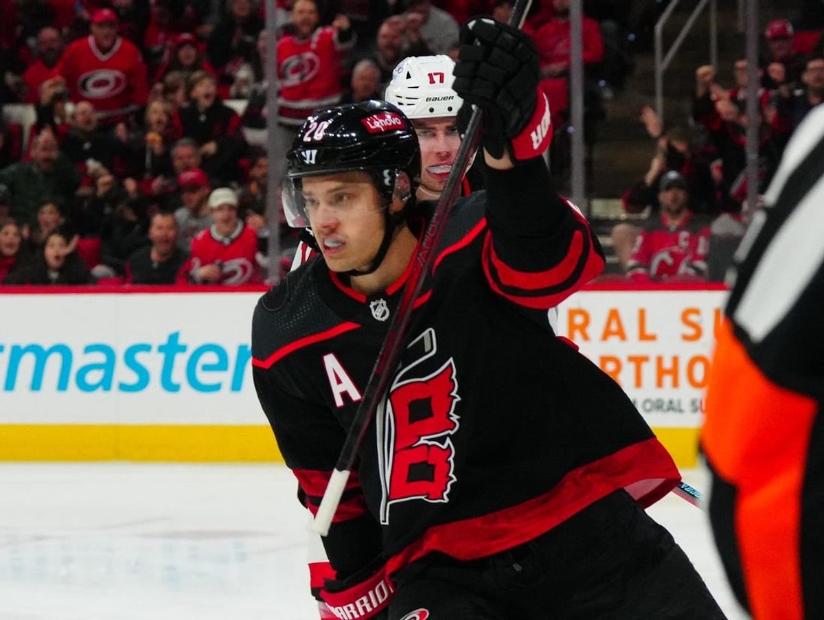 Jan 25, 2024; Raleigh, North Carolina, USA;  Carolina Hurricanes center Sebastian Aho (20) scores a goal against the New Jersey Devils during the first period at PNC Arena.
