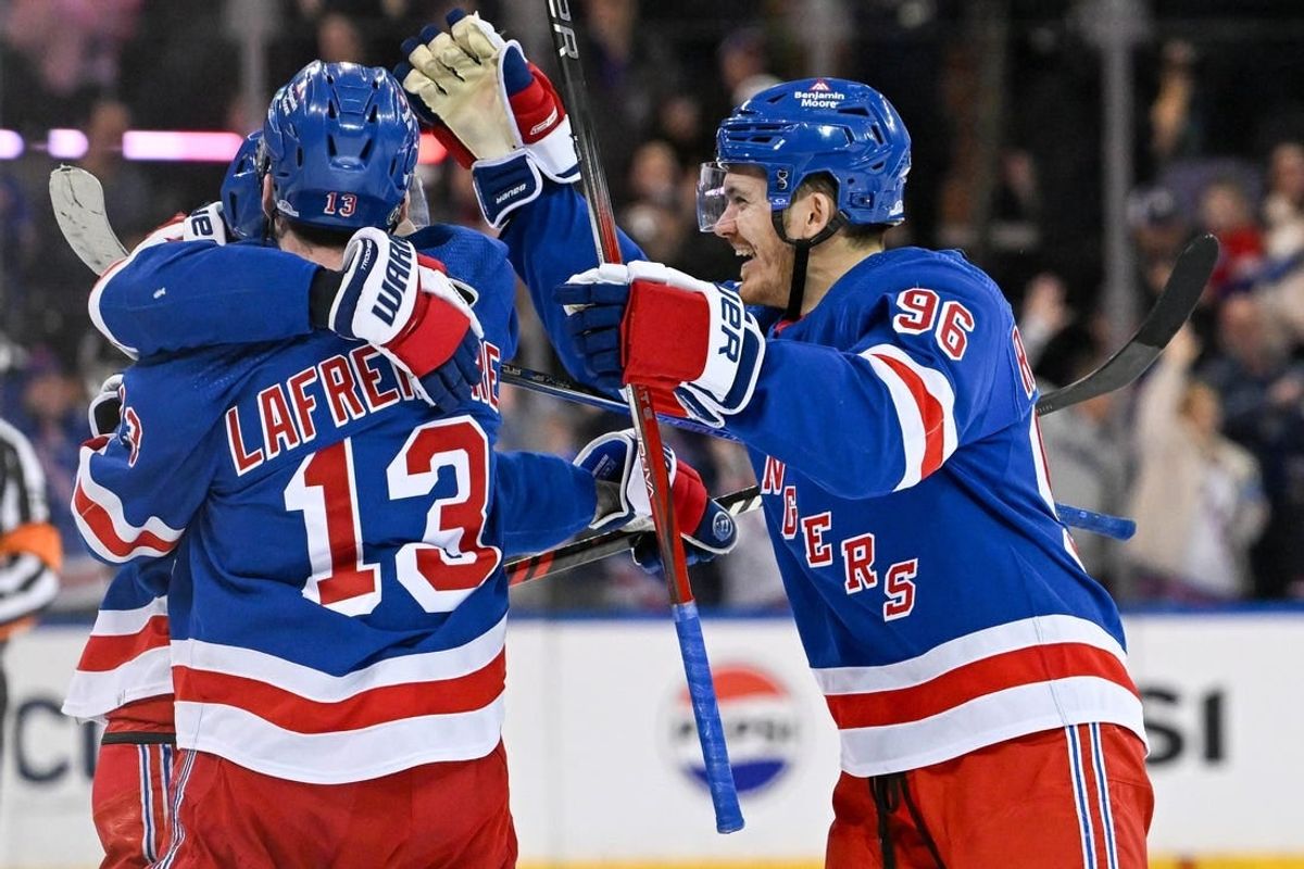 Apr 13, 2024; New York, New York, USA;  New York Rangers left wing Alexis Lafrenière (13) and New York Rangers center Jack Roslovic (96) celebrate with New York Rangers center Vincent Trocheck (16) after scoring the game clinching goal against the New York Islanders after shoot outs at Madison Square Garden.