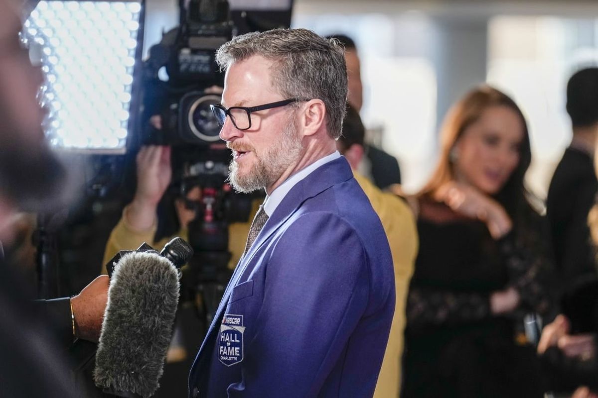 Jan 19, 2024; Charlotte, NC, USA; Dale Earnhardt Jr. talks to interviewers during the red carpet at Charlotte Convention Center Crown Ballroom.