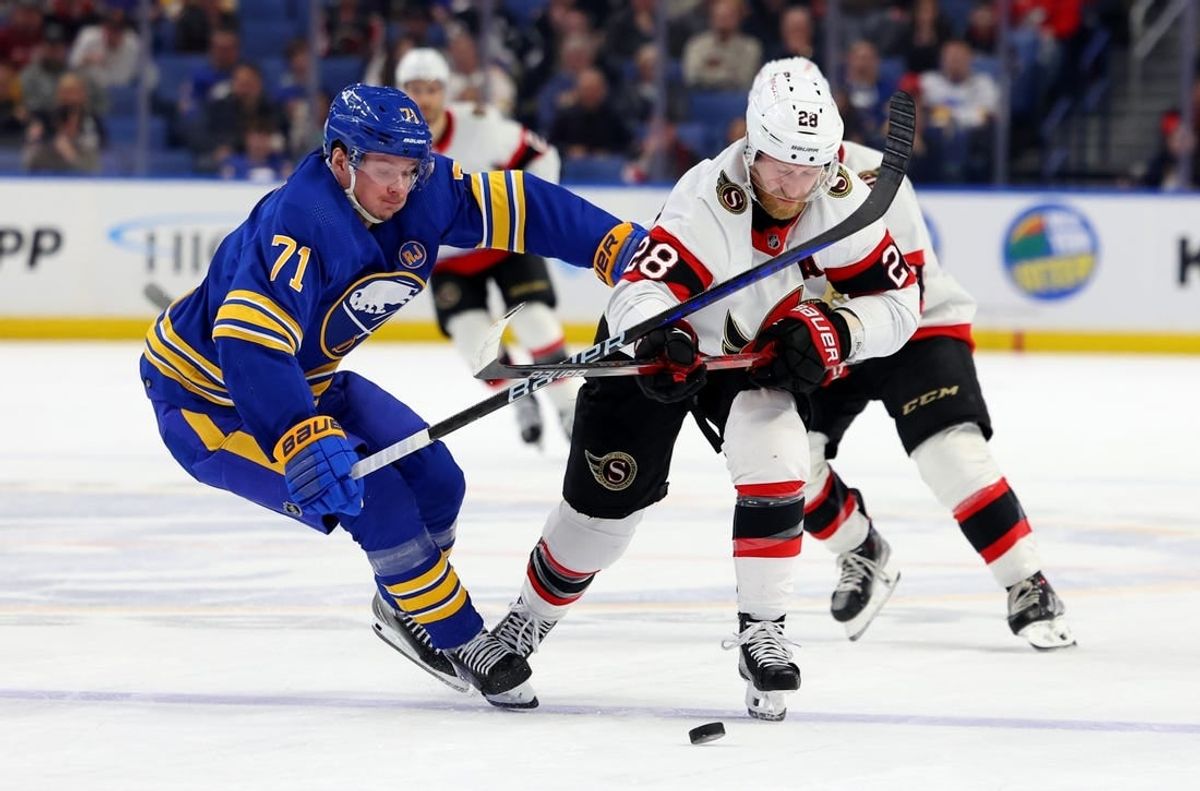 Mar 27, 2024; Buffalo, New York, USA;  Buffalo Sabres left wing Victor Olofsson (71) and Ottawa Senators right wing Claude Giroux (28) battle for a loose puck during the second period at KeyBank Center.