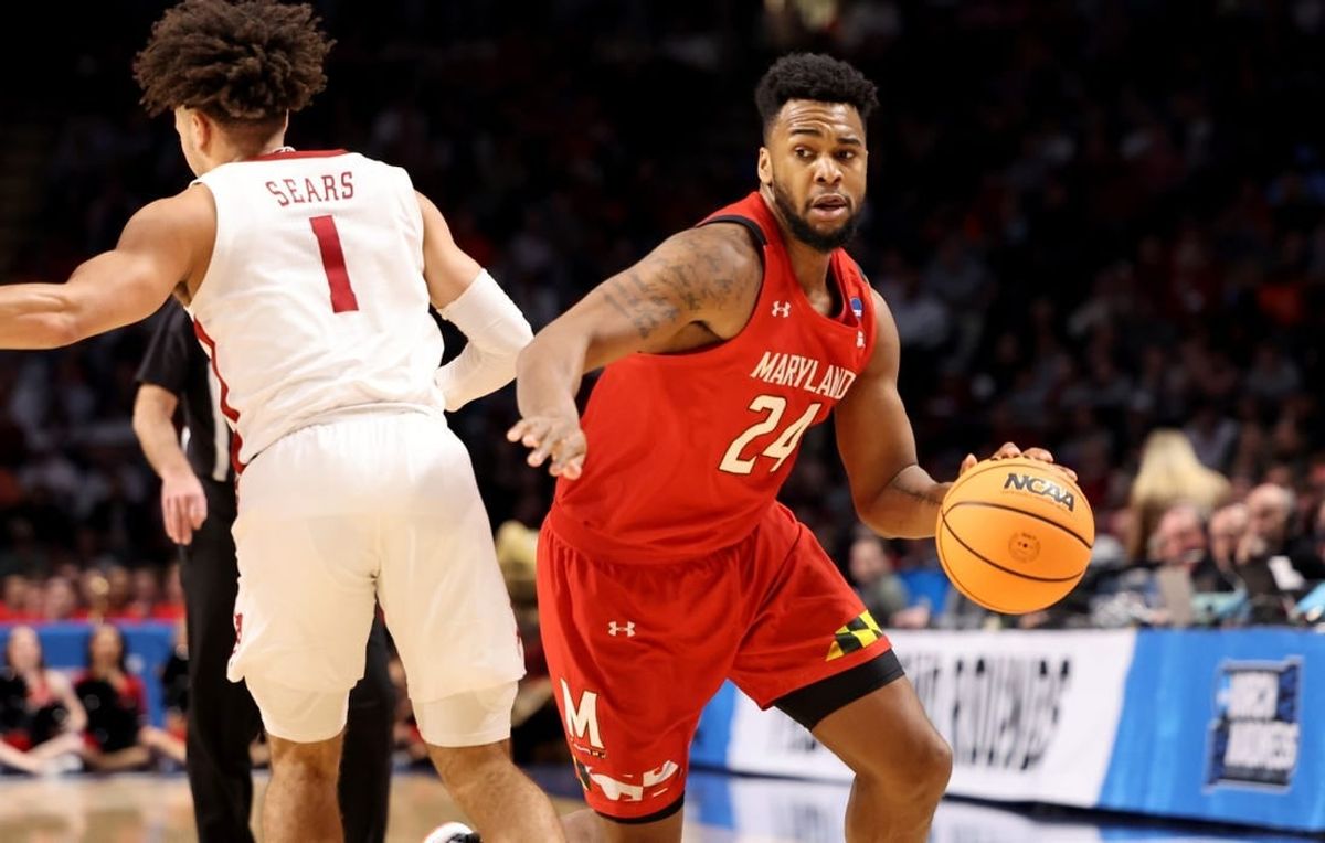 Mar 18, 2023; Birmingham, AL, USA; Maryland Terrapins forward Donta Scott (24) drives past Alabama Crimson Tide guard Mark Sears (1) during the first half at Legacy Arena.