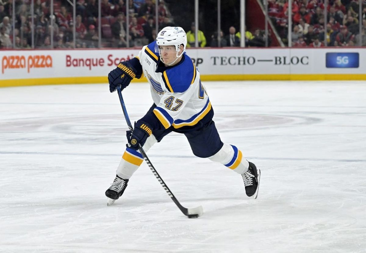 Feb 11, 2024; Montreal, Quebec, CAN;  St.Louis Blues defenseman Torey Krug (47) takes a shot on net during the third period of the game against the Montreal Canadiens at the Bell Centre.
