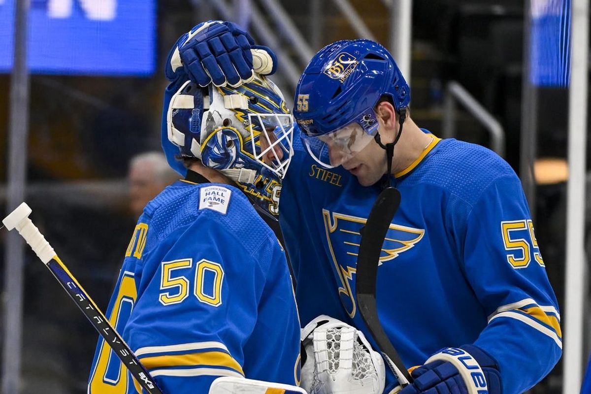 Jan 20, 2024; St. Louis, Missouri, USA;  St. Louis Blues goaltender Jordan Binnington (50) and defenseman Colton Parayko (55) celebrate after the Blues defeated the Washington Capitals at Enterprise Center.