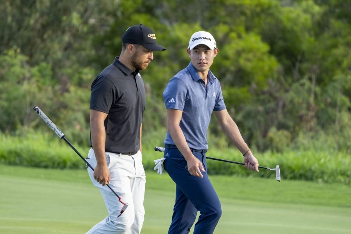 January 4, 2024; Maui, Hawaii, USA; Xander Schauffele (left) and Collin Morikawa (right) walk on the fourth hole during the first round of The Sentry Tournament of Champions golf tournament at Kapalua Golf - The Plantation Course.