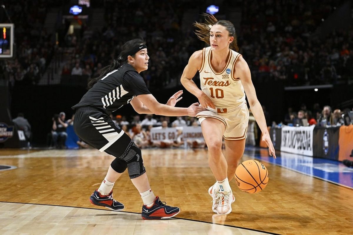 Mar 29, 2024; Portland, OR, USA; Texas Longhorns guard Shay Holle (10) dribbles the basketball during the first half against Gonzaga Bulldogs guard Kaylynne Truong (14) in the semifinals of the Portland Regional of the 2024 NCAA Tournament at the Moda Center at the Moda Center.