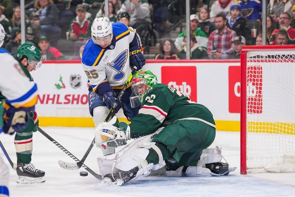 Nov 28, 2023; Saint Paul, Minnesota, USA; St. Louis Blues center Jordan Kyrou (25) shoots against the Minnesota Wild goaltender Filip Gustavsson (32) in the third period at Xcel Energy Center.