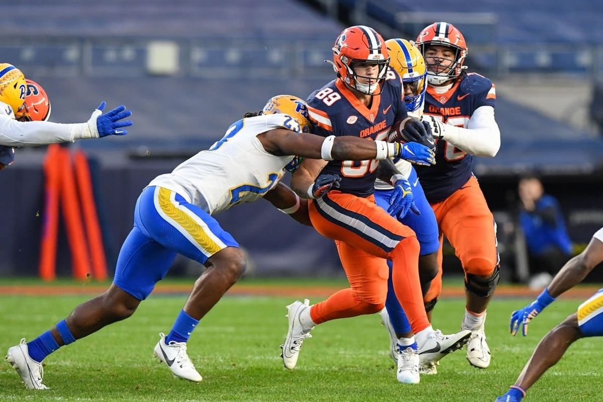 Nov 11, 2023; New York, New York, USA;  Pittsburgh Panthers defensive back Noah Biglow (28) attempts a tackle ion Syracuse Orange tight end Dan Villari (89) during the first half at Yankee Stadium.