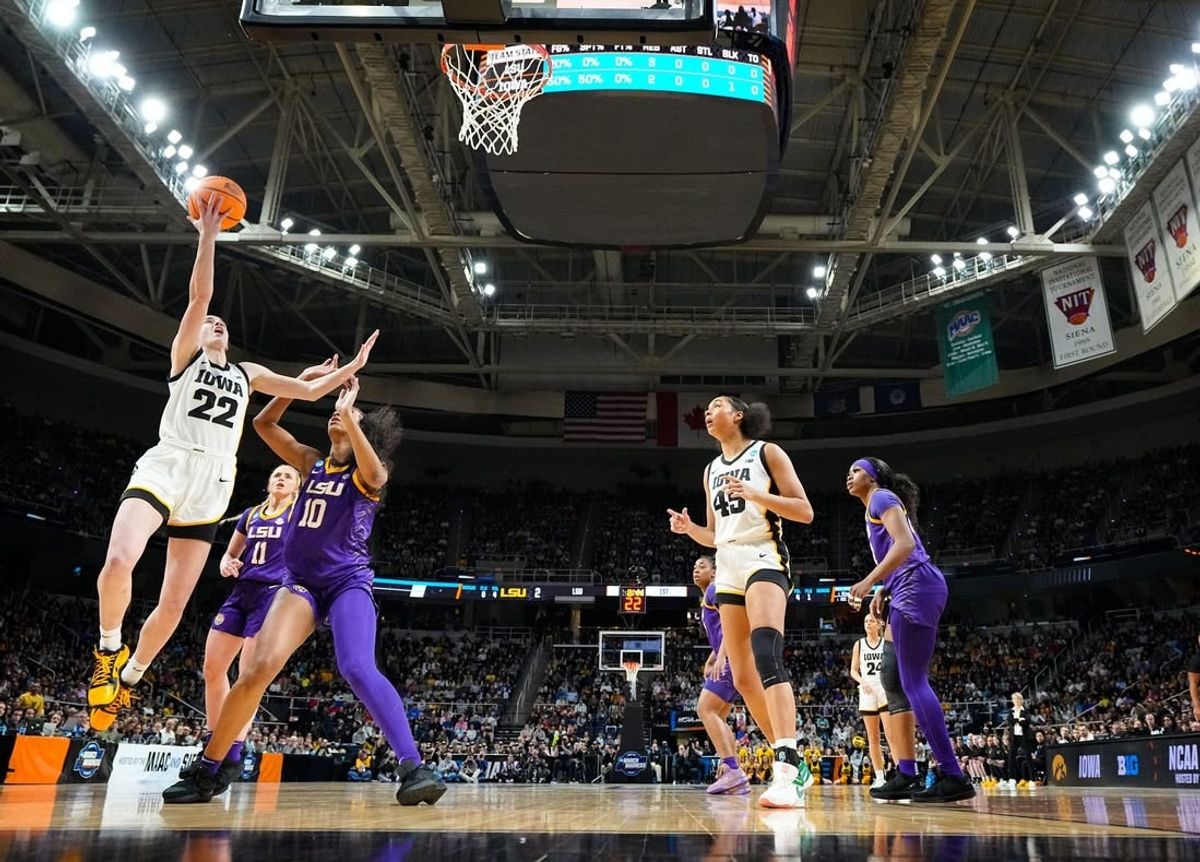 Iowa Hawkeyes guard Caitlin Clark (22) drives to the basket as LSU Lady Tigers forward Angel Reese (10) defends during the Elite 8 round of the NCAA Women's Basketball Tournament between Iowa and LSU at MVP Arena, Monday, April 1, 2024 in Albany, N.Y.
