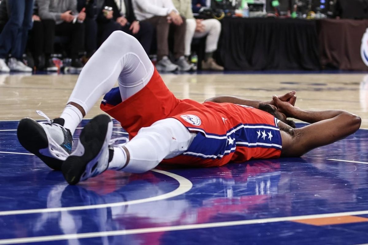 Apr 20, 2024; New York, New York, USA; Philadelphia 76ers center Joel Embiid (21) lays on the court after getting injured in the second quarter during game one of the first round for the 2024 NBA playoffs against the New York Knicks at Madison Square Garden.