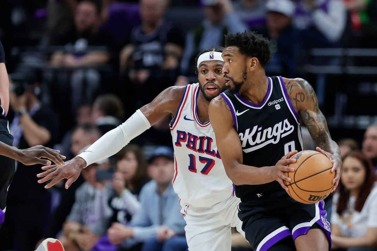 Mar 25, 2024; Sacramento, California, USA; Sacramento Kings guard Malik Monk (0) controls the ball against Philadelphia 76ers guard Buddy Hield (17) during the second quarter at Golden 1 Center.
