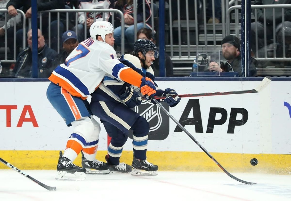 Oct 28, 2023; Columbus, Ohio, USA; New York Islanders left wing Matt Martin (17) fights for the puck with Columbus Blue Jackets left wing Johnny Gaudreau (13)during the first period at Nationwide Arena.
