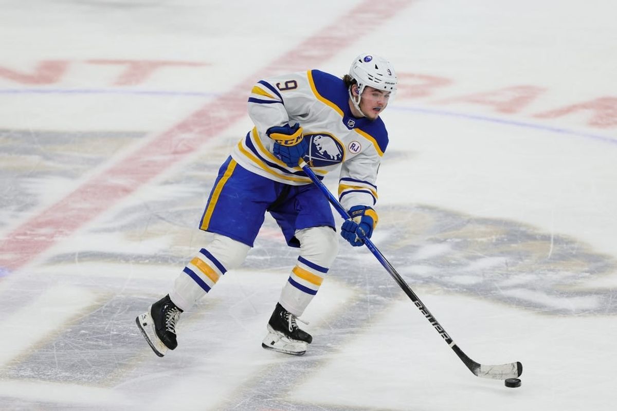 Feb 27, 2024; Sunrise, Florida, USA; Buffalo Sabres left wing Zach Benson (9) moves the puck against the Florida Panthers during the third period at Amerant Bank Arena.