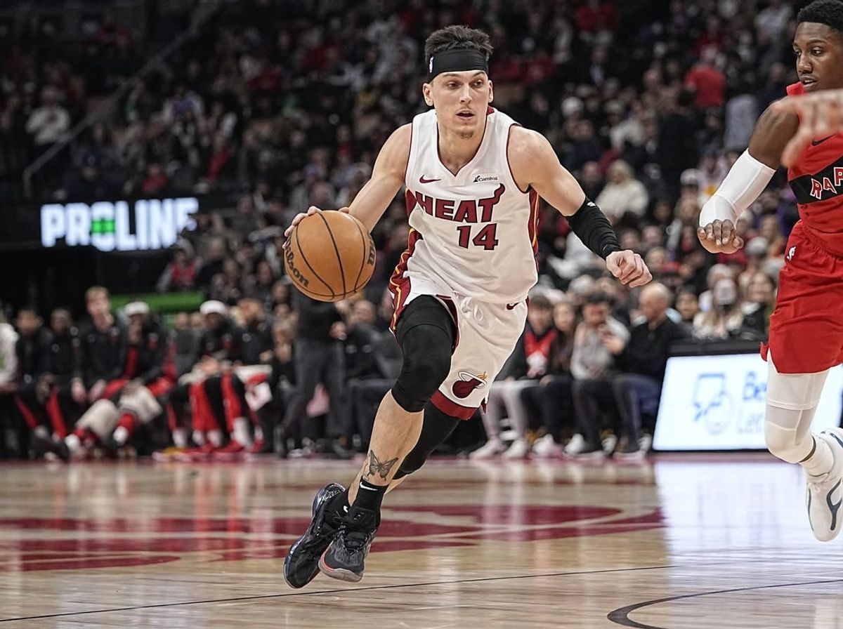 Jan 17, 2024; Toronto, Ontario, CAN;  Miami Heat guard Tyler Herro (14) dribbles to the net against the Toronto Raptors during the first half at Scotiabank Arena.