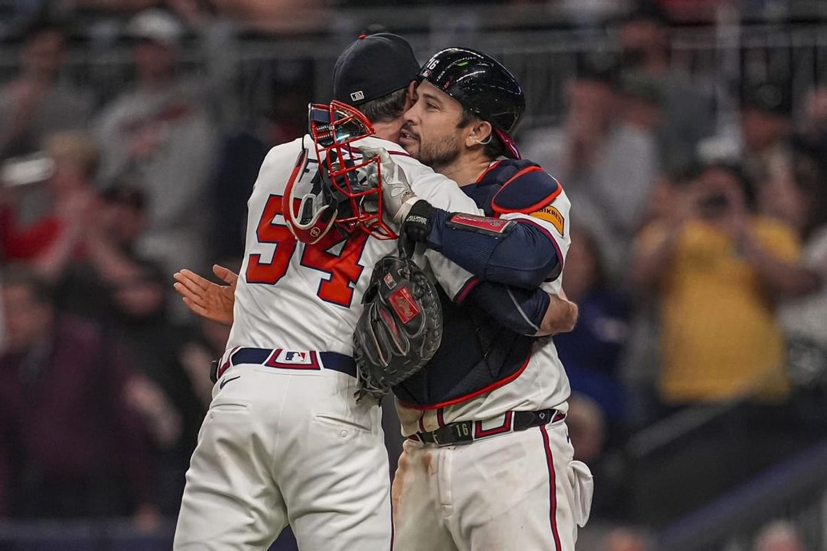 Apr 23, 2024; Cumberland, Georgia, USA; Atlanta Braves pitcher Max Fried (54) reacts with catcher Travis d'Arnaud (16) after pitching a complete game shutout against the Miami Marlins at Truist Park.