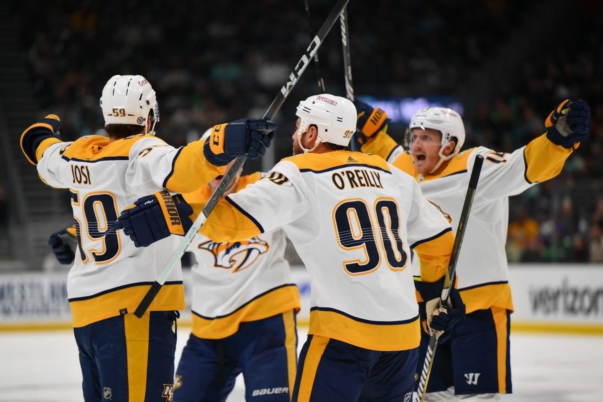 Mar 16, 2024; Seattle, Washington, USA; The Nashville Predators celebrate after defenseman Roman Josi (59) scored a goal against the Seattle Kraken during the third period at Climate Pledge Arena.