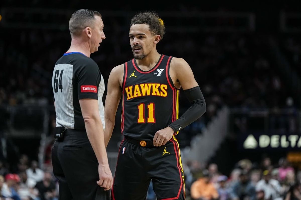 Feb 23, 2024; Atlanta, Georgia, USA; Atlanta Hawks guard Trae Young (11) disputes a call with official Justin Van Duyne (64) before being called for a technical foul during the game against the Toronto Raptors during the first half at State Farm Arena.