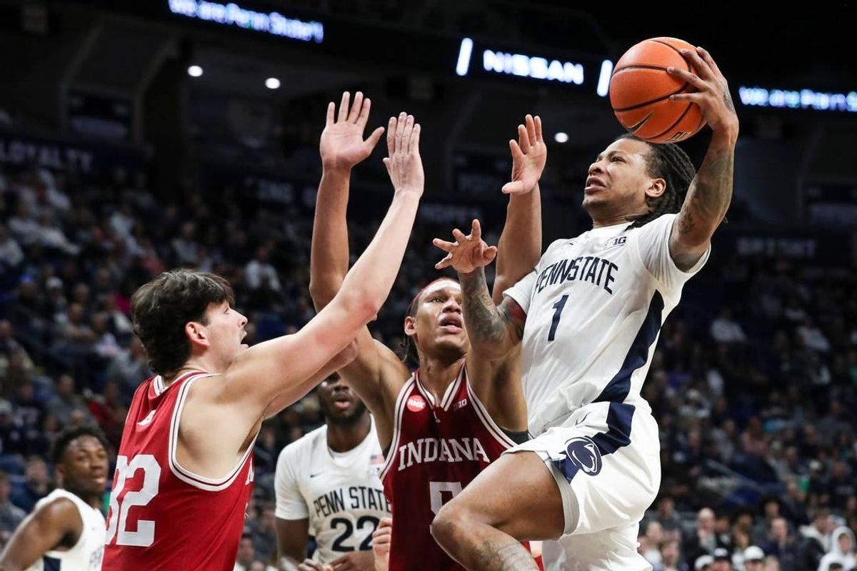 Feb 24, 2024; University Park, Pennsylvania, USA; Penn State Nittany Lions guard Ace Baldwin Jr (1) drives to the basket as Indiana Hoosiers guard Trey Galloway (32) defends during the first half at Bryce Jordan Center.