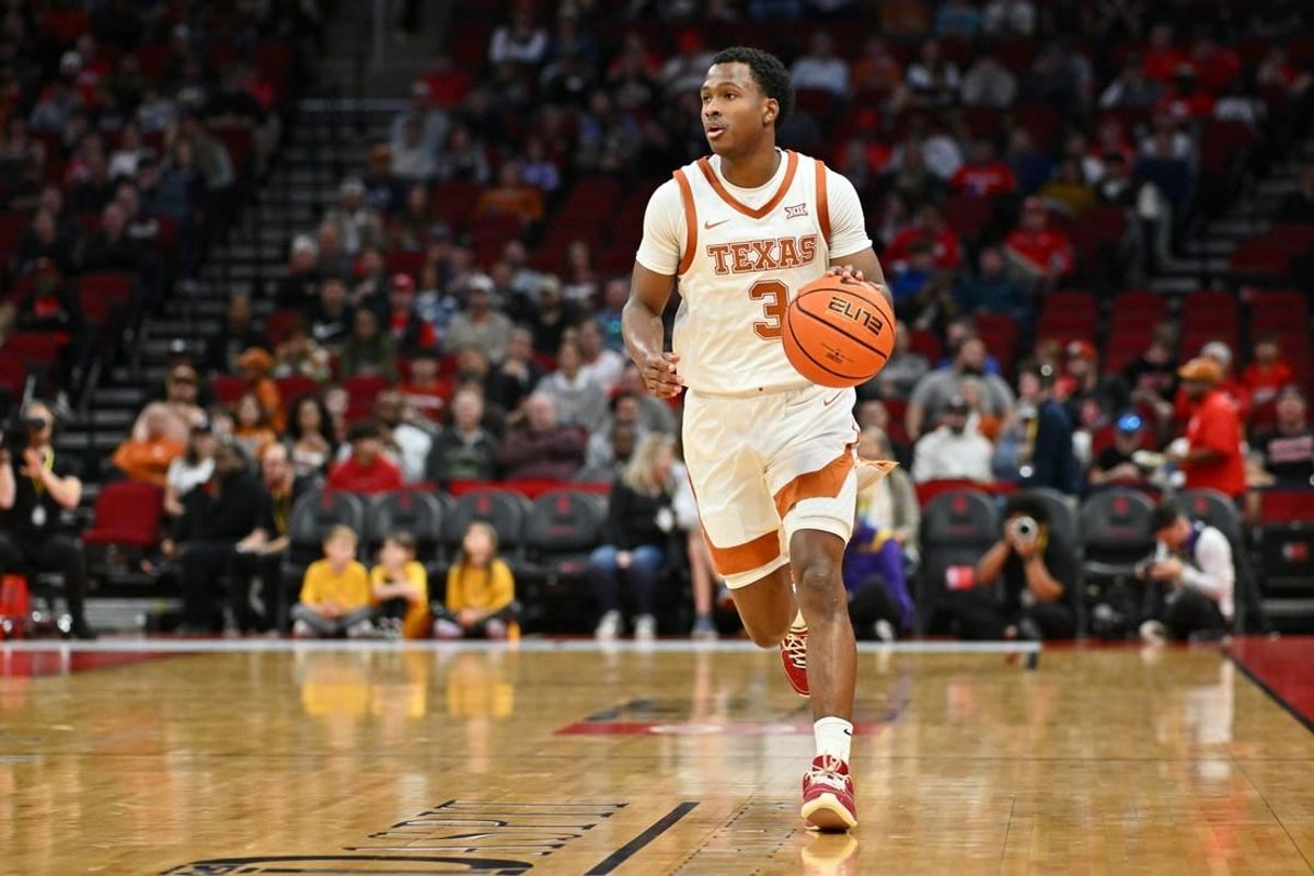 Dec 16, 2023; Houston, Texas, USA; Texas Longhorns guard Max Abmas (3) dribbles the ball against the LSU Tigers during the first half at Toyota Center.