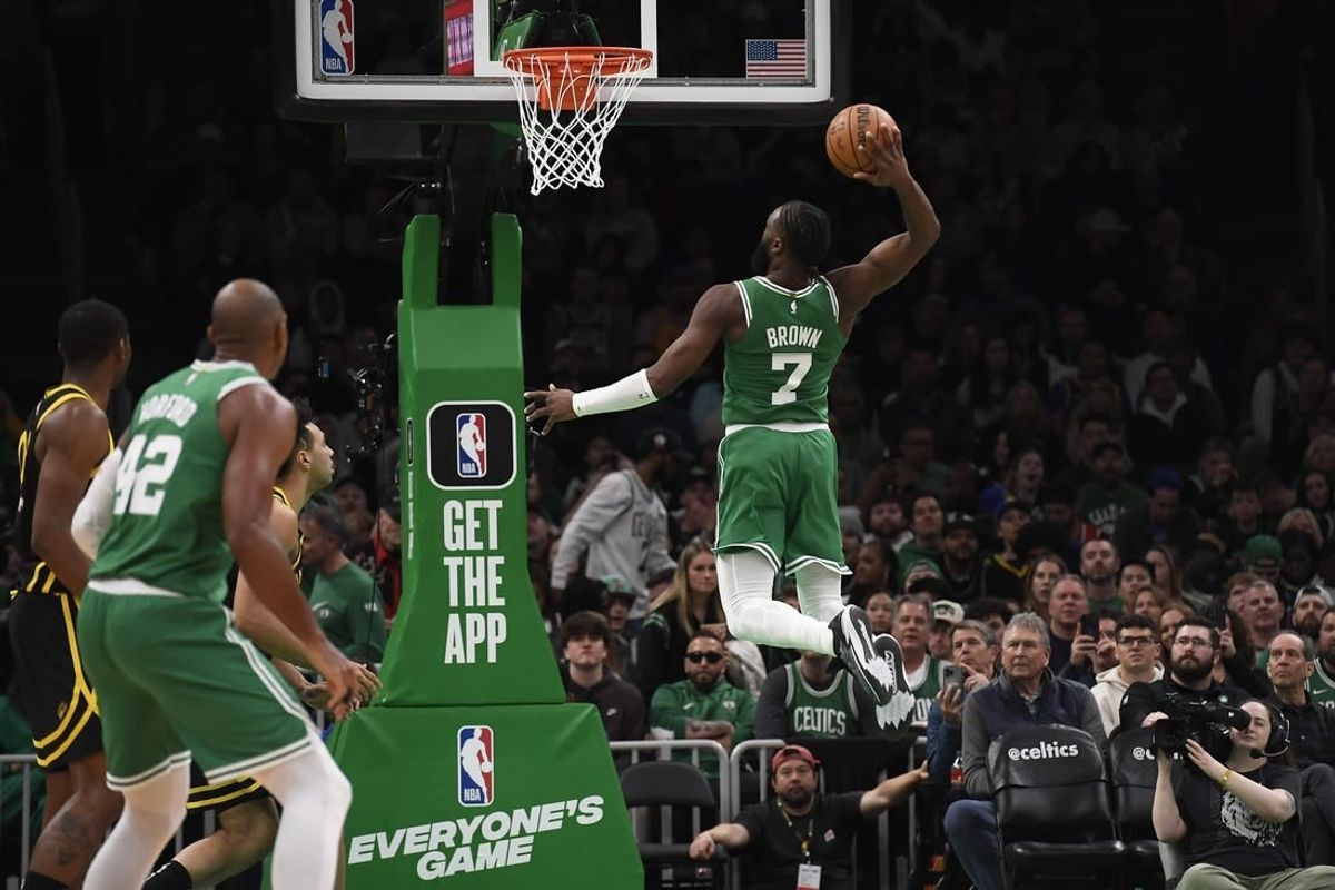 Mar 3, 2024; Boston, Massachusetts, USA;  Boston Celtics guard Jaylen Brown (7) goes in for a dunk during the second half against the Golden State Warriors at TD Garden.