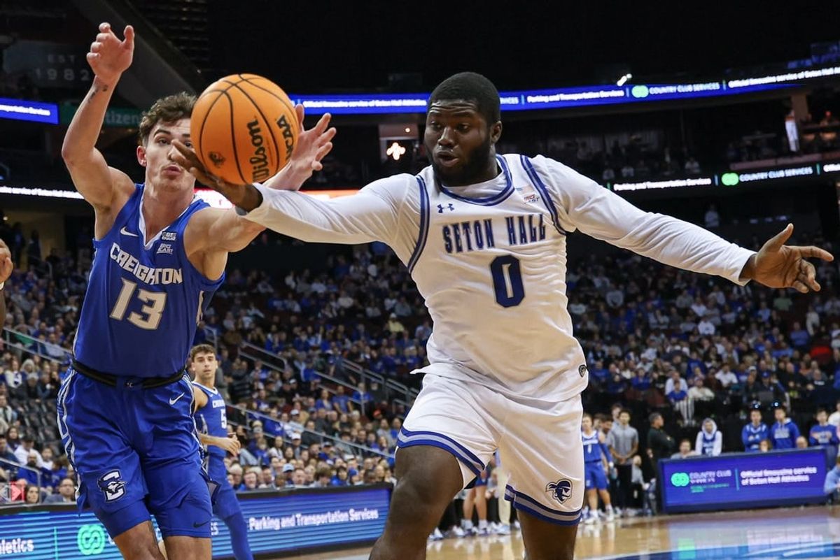 Jan 20, 2024; Newark, New Jersey, USA; Seton Hall Pirates guard Dylan Addae-Wusu (0) reaches for the ball against Creighton Bluejays forward Mason Miller (13) during the first half at Prudential Center.