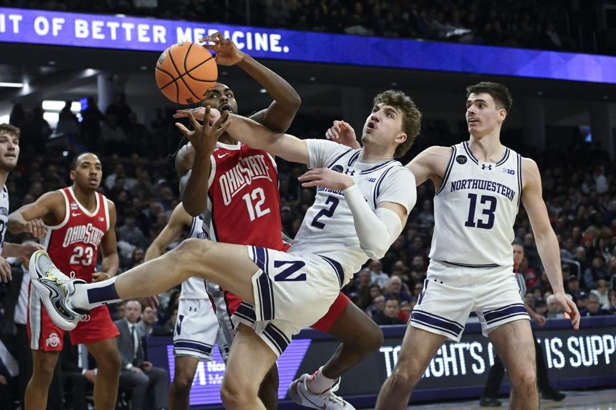 Jan 27, 2024; Evanston, Illinois, USA; Ohio State Buckeyes guard Evan Mahaffey (12) and Northwestern Wildcats forward Nick Martinelli (2) fight for a rebound during the first half  at Welsh-Ryan Arena.
