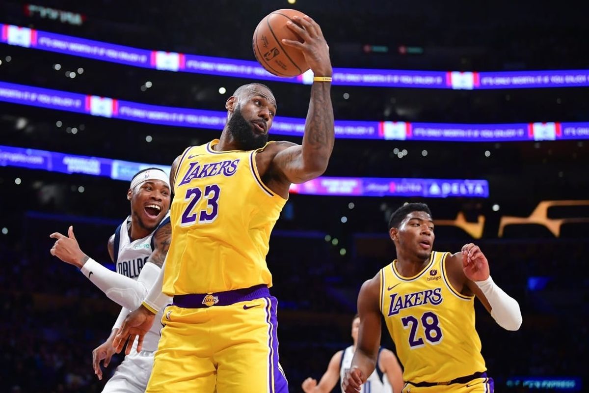 Nov 22, 2023; Los Angeles, California, USA; Los Angeles Lakers forward LeBron James (23) gets the rebound against the Dallas Mavericks during the first half at Crypto.com Arena.